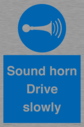 sound-horn-drive-slowly-warehousing-and-delivery-sign~